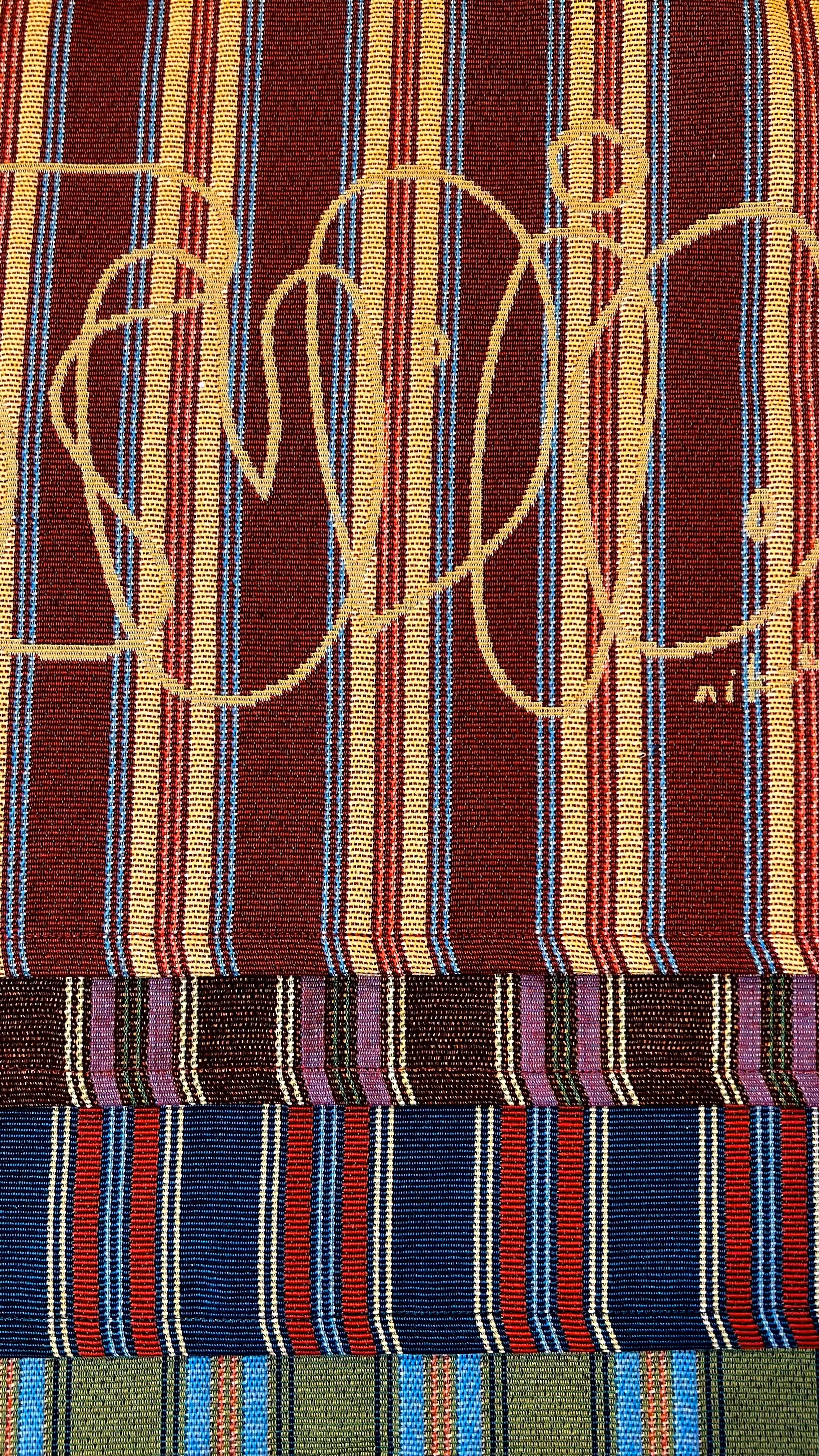 layered fabric of red blue and green with patterns